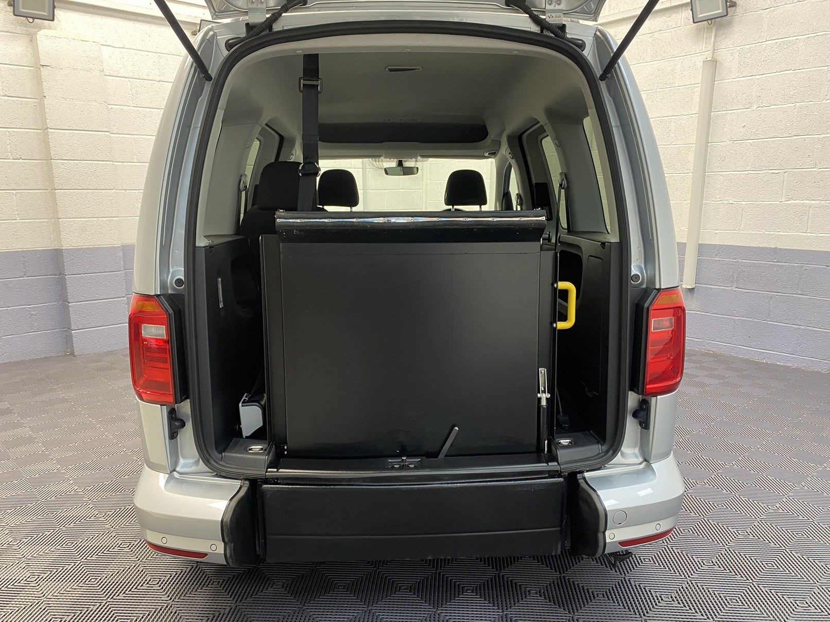 A silver Volkswagen Caddy Life wheelchair accessible vehicle WAV that is for sale at Michael Harraway Cars in Weston super Mare. HJ20 AXZ 9