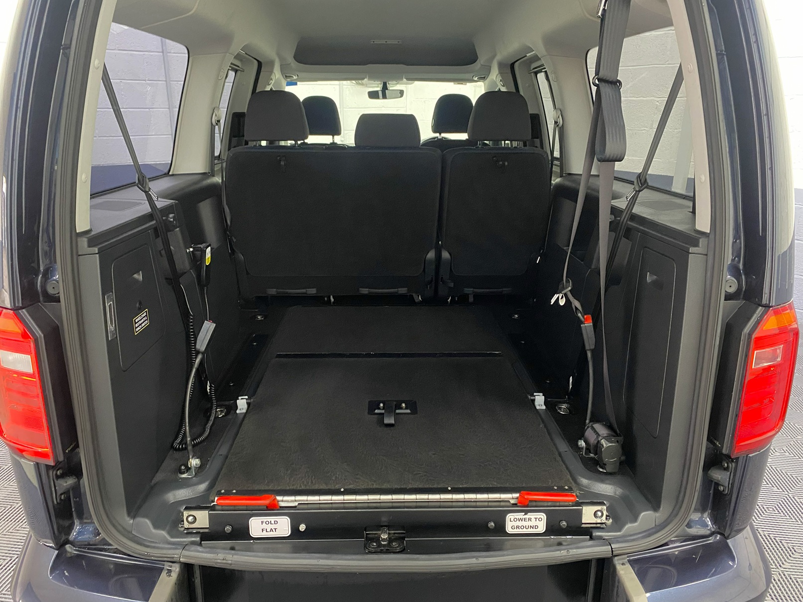 The fold flat rear wheelchair ramp fitted in a Volkswagen Caddy Maxi YY68 LHF 13