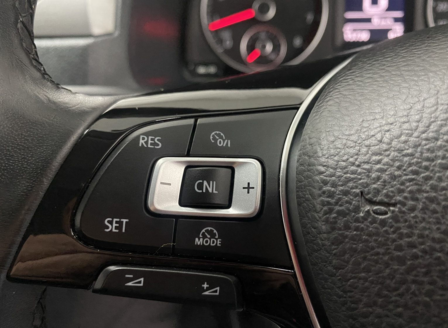Cruise Control buttons on steering wheel in a Volkswagen Caddy Maxi Wheelchair accessible Vehicle YY68 LHF 1
