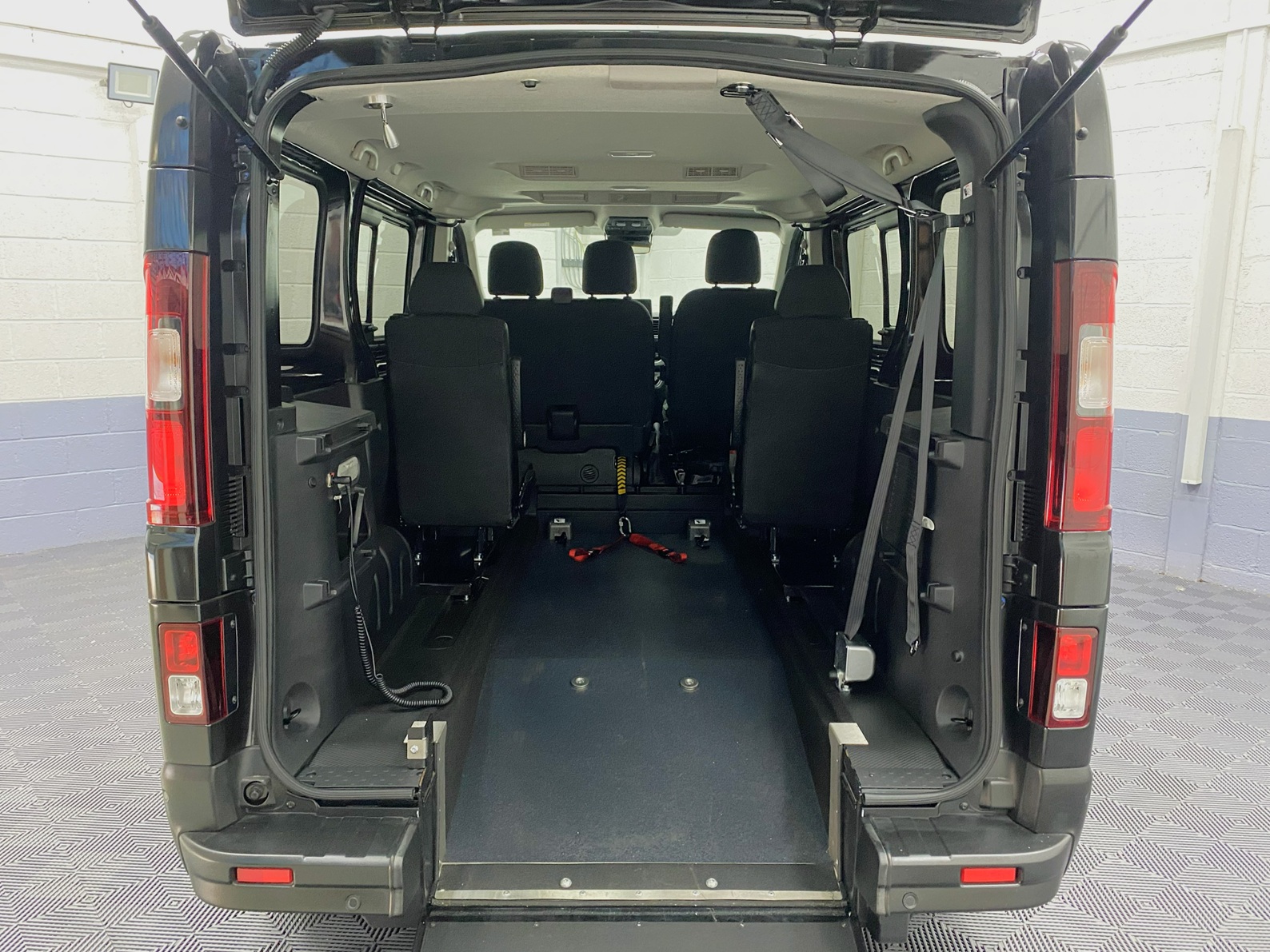 A black Renault Trafic Wheelchair Accessible Vehicle WAV that is for sale at Michael Harraway Cars in Weston super Mare. OU74 EFH 100