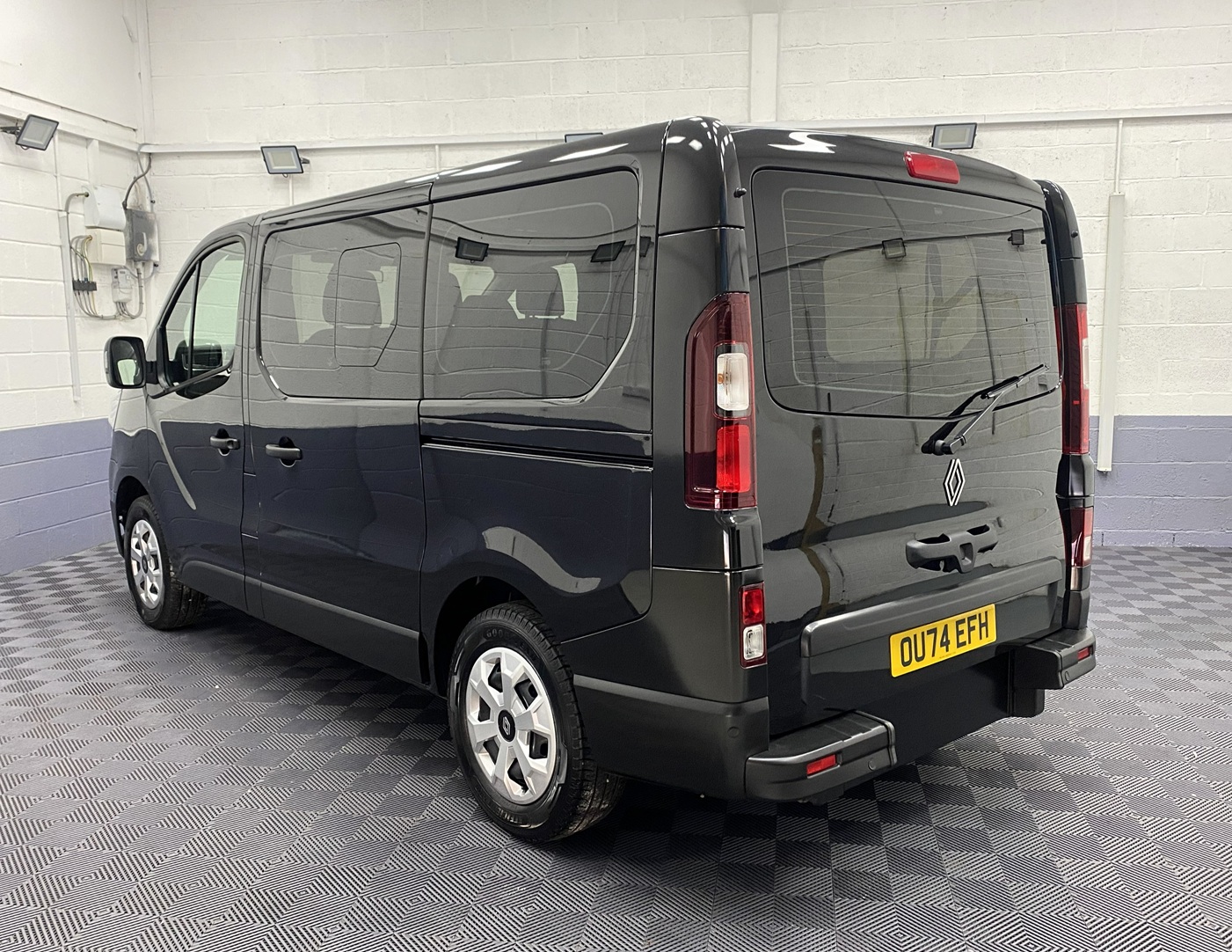 A black Renault Trafic Wheelchair Accessible Vehicle WAV that is for sale at Michael Harraway Cars in Weston super Mare. OU74 EFH 1