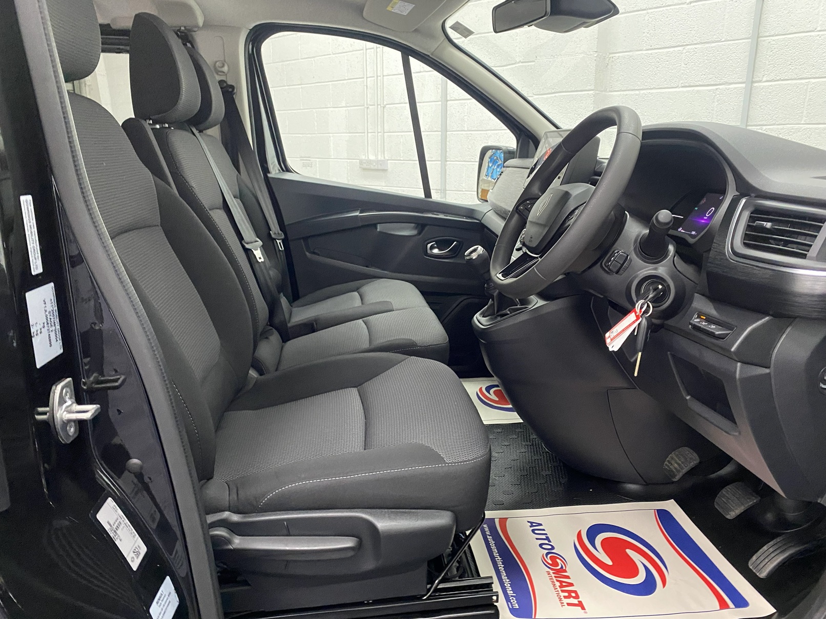 A black Renault Trafic Wheelchair Accessible Vehicle WAV that is for sale at Michael Harraway Cars in Weston super Mare. OU74 EFH 12