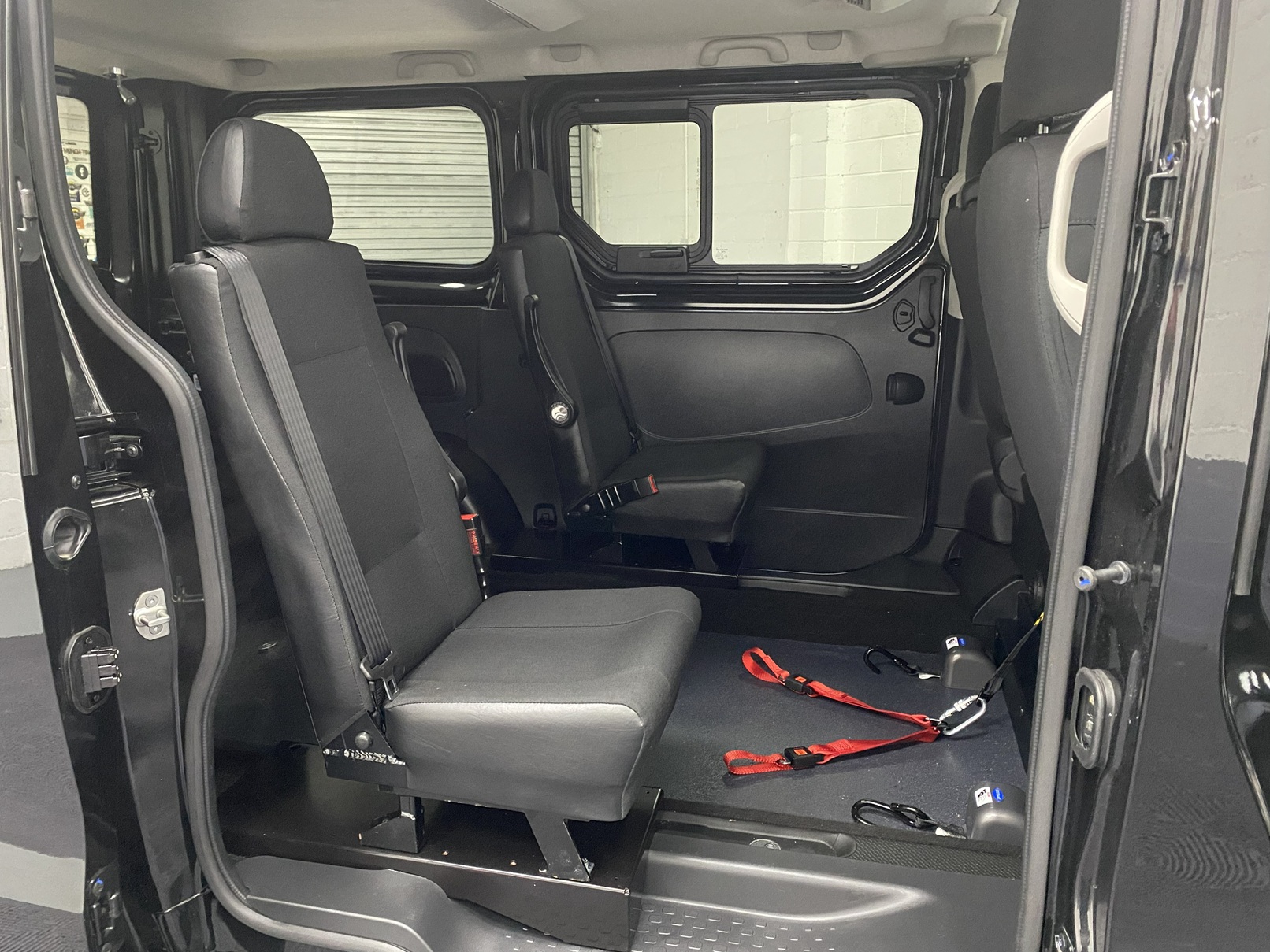 A black Renault Trafic Wheelchair Accessible Vehicle WAV that is for sale at Michael Harraway Cars in Weston super Mare. OU74 EFH 14