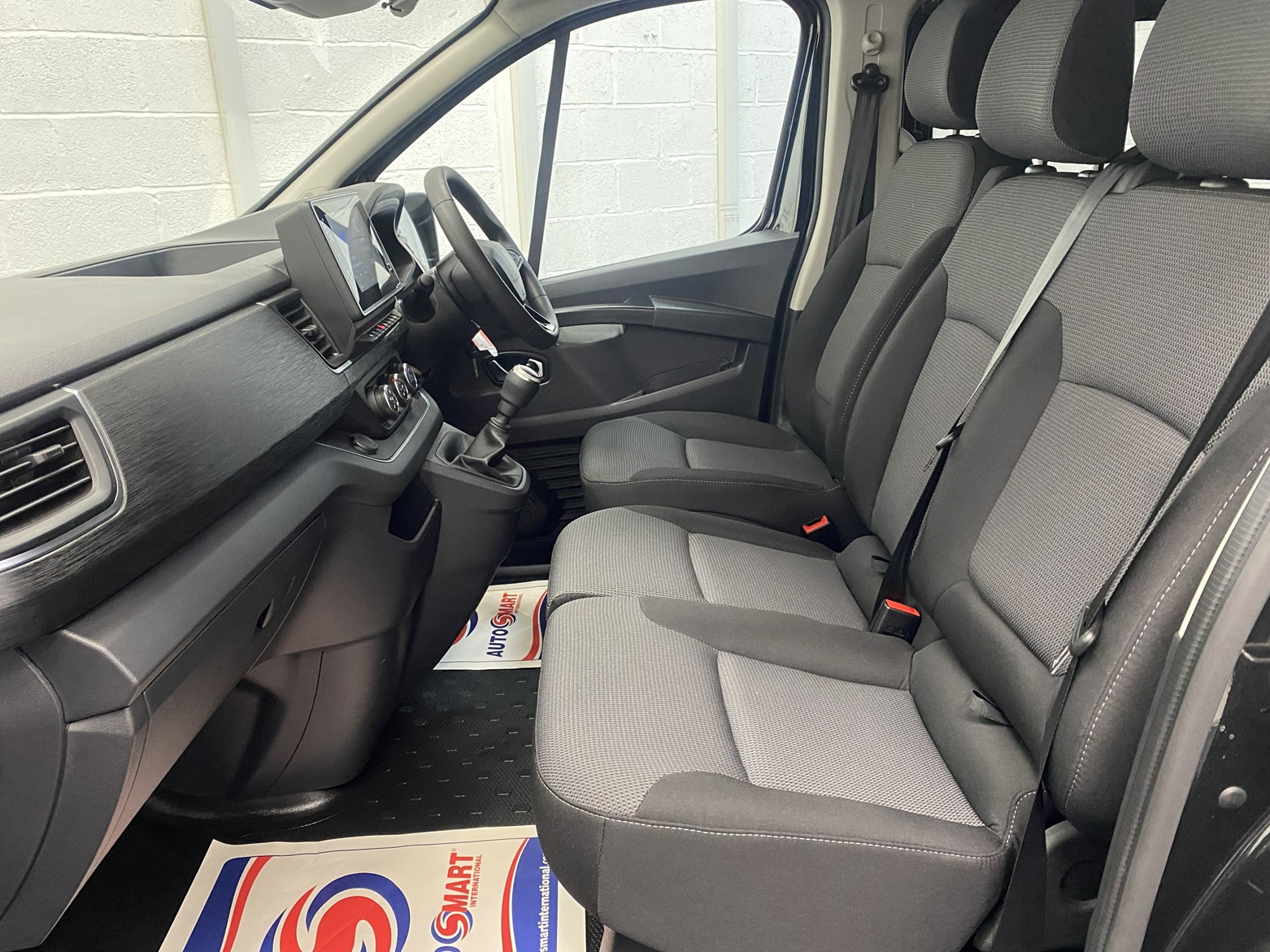 A black Renault Trafic Wheelchair Accessible Vehicle WAV that is for sale at Michael Harraway Cars in Weston super Mare. OU74 EFH 18