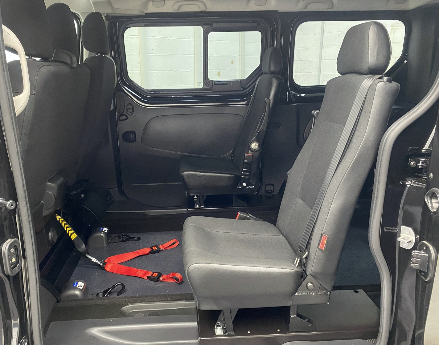 A black Renault Trafic Wheelchair Accessible Vehicle WAV that is for sale at Michael Harraway Cars in Weston super Mare. OU74 EFH 19