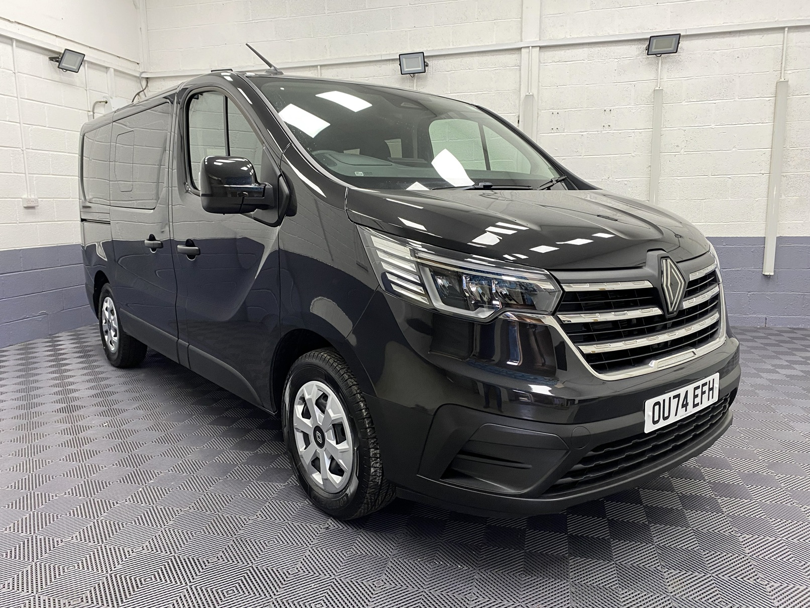 A black Renault Trafic Wheelchair Accessible Vehicle WAV that is for sale at Michael Harraway Cars in Weston super Mare. OU74 EFH 21