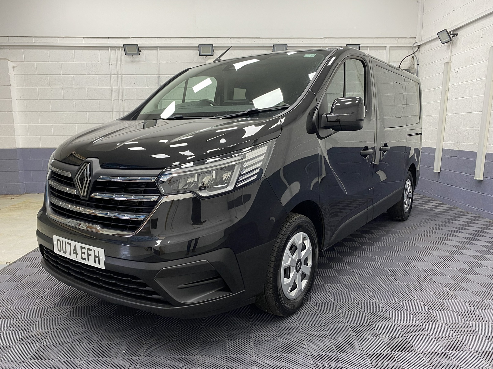 A black Renault Trafic Wheelchair Accessible Vehicle WAV that is for sale at Michael Harraway Cars in Weston super Mare. OU74 EFH 23
