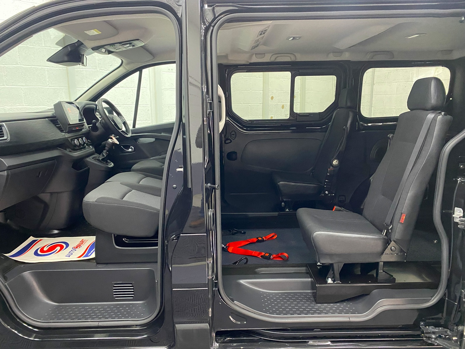 A black Renault Trafic Wheelchair Accessible Vehicle WAV that is for sale at Michael Harraway Cars in Weston super Mare. OU74 EFH 9