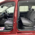 New shape Volkswagen Caddy Maxi in metallic Red that has been adapted to carry a wheelchair passenger. ND72 HOJ 1