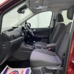 New shape Volkswagen Caddy Maxi in metallic Red that has been adapted to carry a wheelchair passenger. ND72 HOJ 12