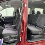 New shape Volkswagen Caddy Maxi in metallic Red that has been adapted to carry a wheelchair passenger. ND72 HOJ 13