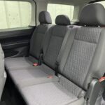 New shape Volkswagen Caddy Maxi in metallic Red that has been adapted to carry a wheelchair passenger. ND72 HOJ 15