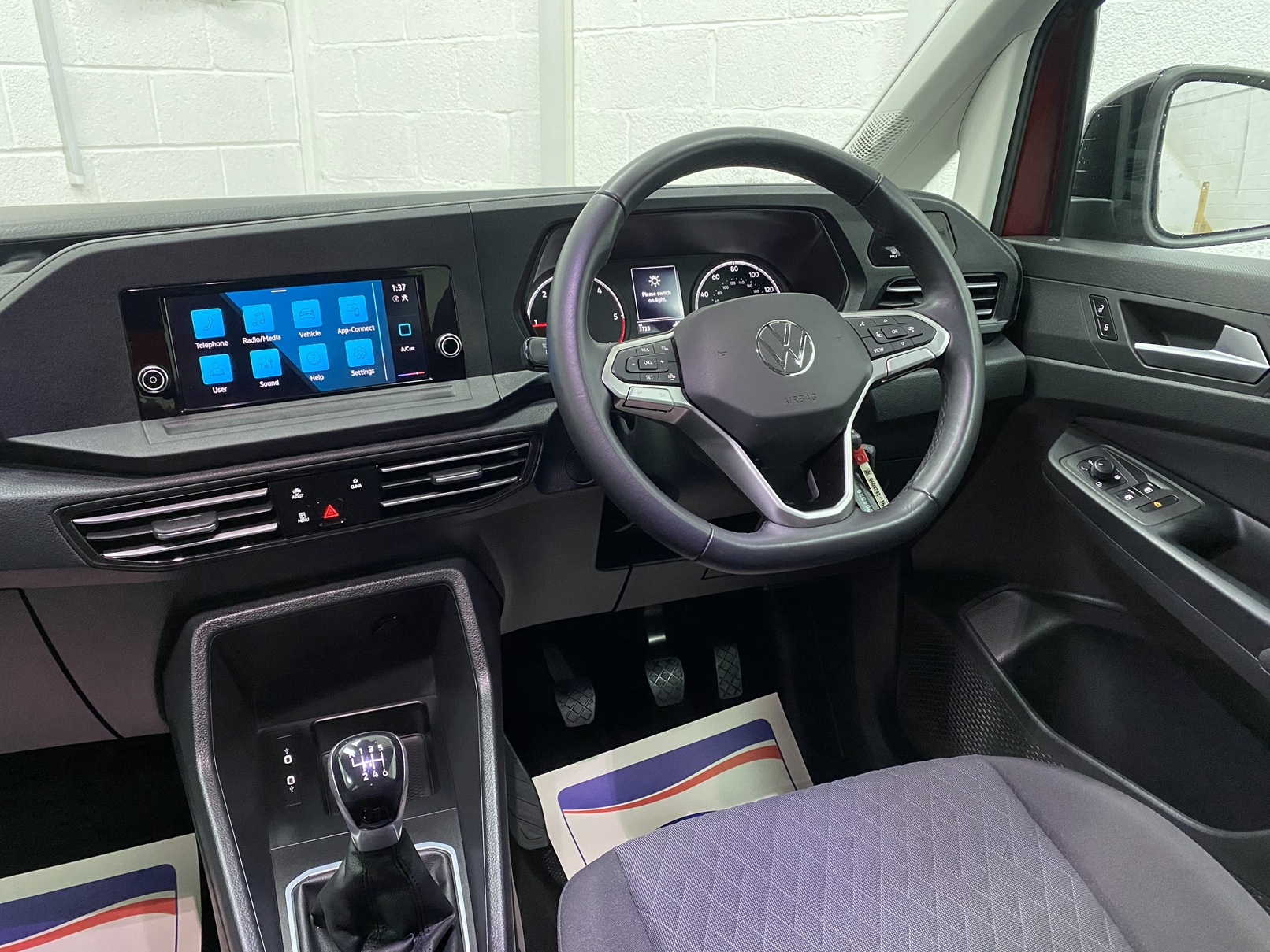 New shape Volkswagen Caddy Maxi in metallic Red that has been adapted to carry a wheelchair passenger. ND72 HOJ 16