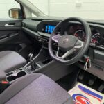 New shape Volkswagen Caddy Maxi in metallic Red that has been adapted to carry a wheelchair passenger. ND72 HOJ 17