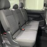 New shape Volkswagen Caddy Maxi in metallic Red that has been adapted to carry a wheelchair passenger. ND72 HOJ 18