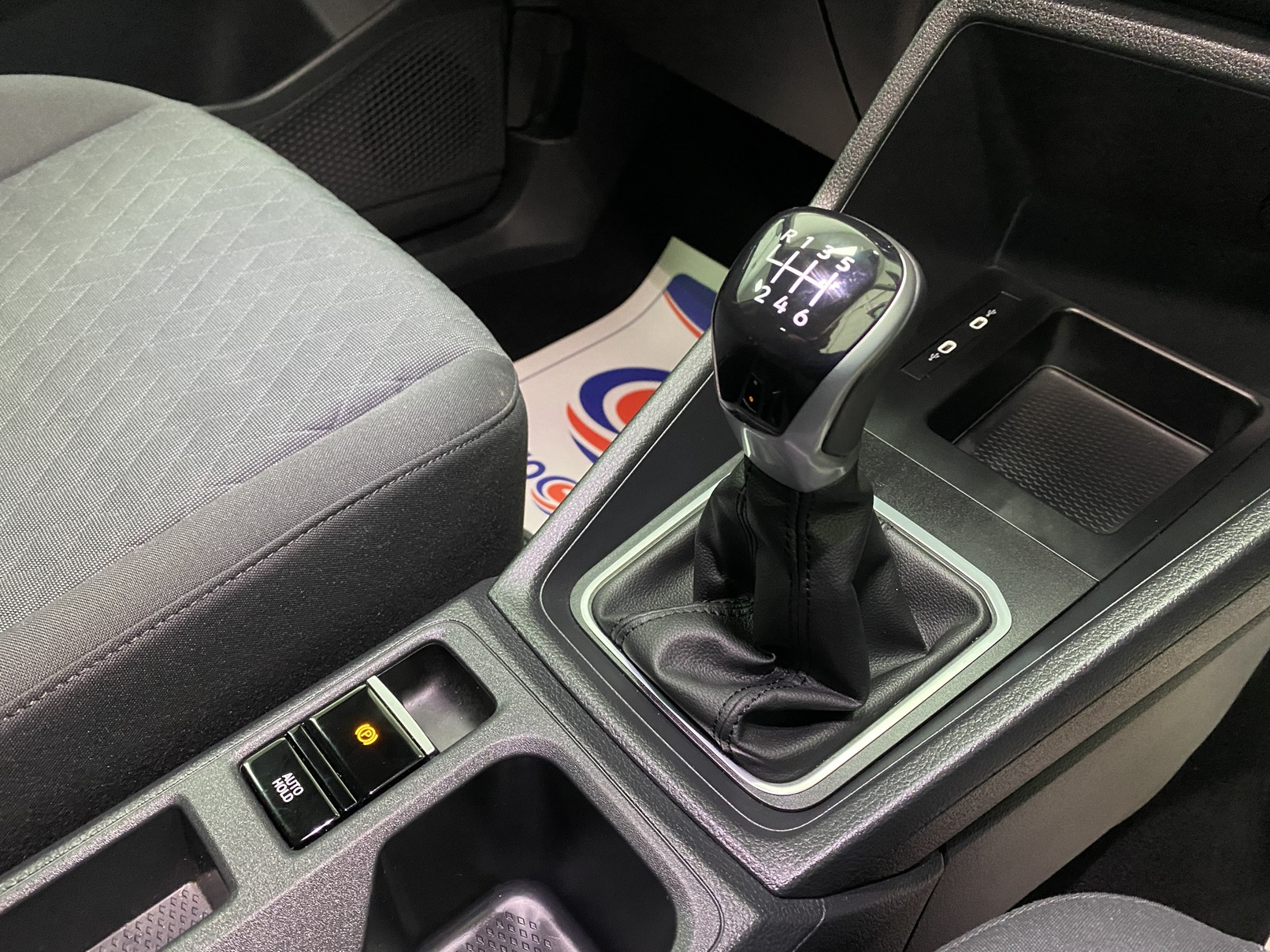 New shape Volkswagen Caddy Maxi in metallic Red that has been adapted to carry a wheelchair passenger. ND72 HOJ 24