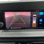 New shape Volkswagen Caddy Maxi in metallic Red that has been adapted to carry a wheelchair passenger. ND72 HOJ 26