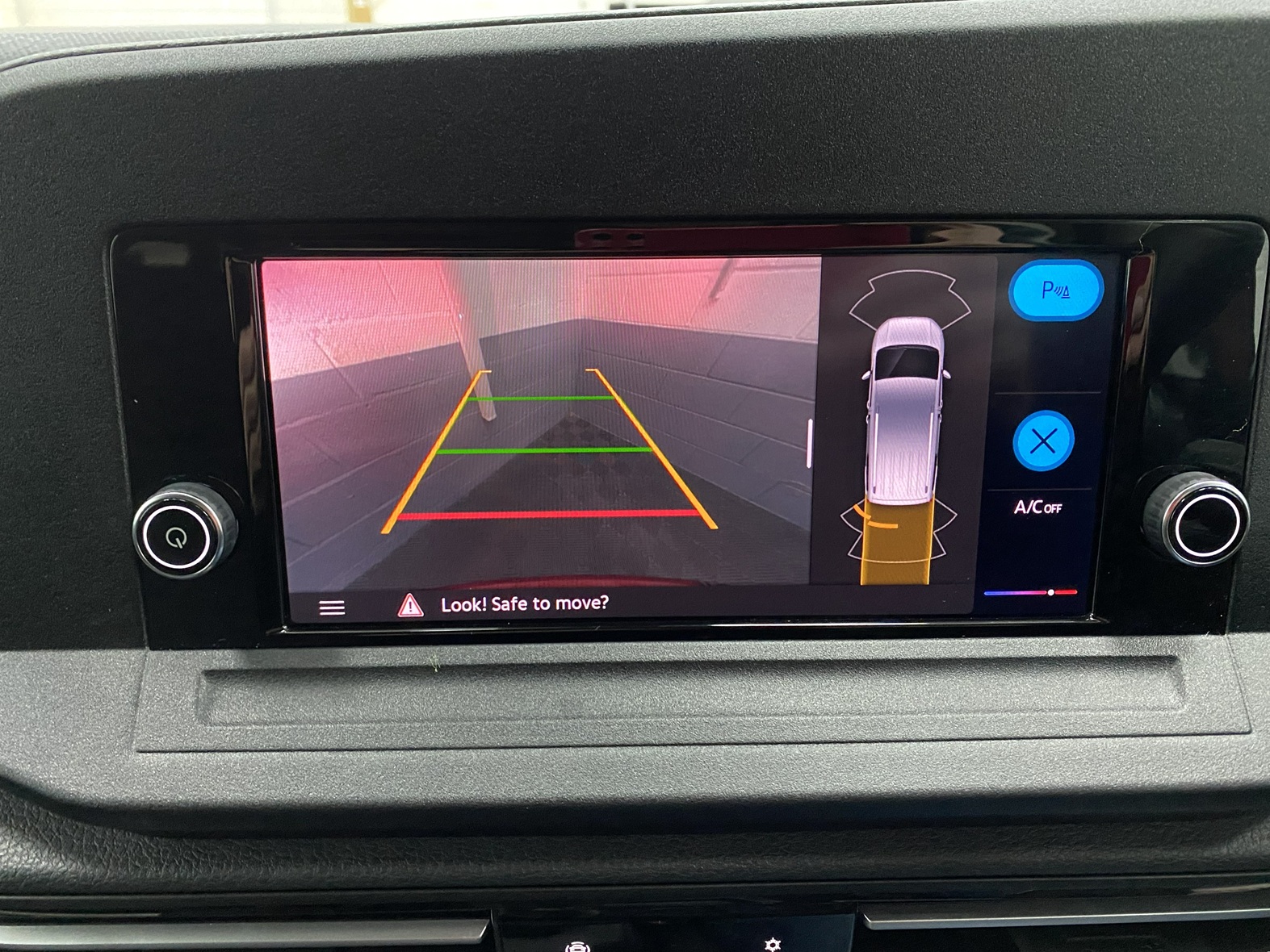 New shape Volkswagen Caddy Maxi in metallic Red that has been adapted to carry a wheelchair passenger. ND72 HOJ 26