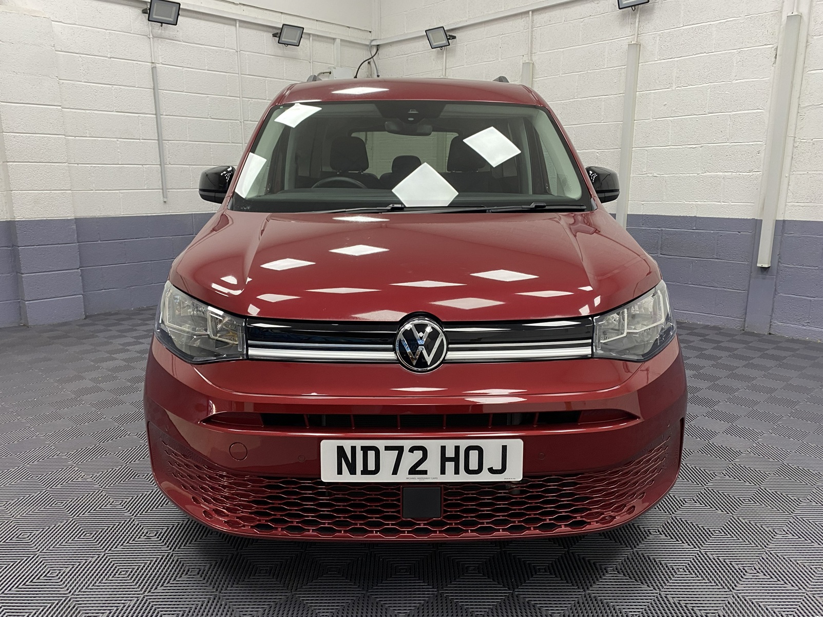 New shape Volkswagen Caddy Maxi in metallic Red that has been adapted to carry a wheelchair passenger. ND72 HOJ 29