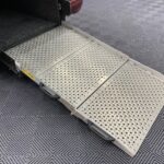 New shape Volkswagen Caddy Maxi in metallic Red that has been adapted to carry a wheelchair passenger. ND72 HOJ 55