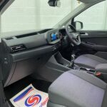 New shape Volkswagen Caddy Maxi in metallic Red that has been adapted to carry a wheelchair passenger. ND72 HOJ 9