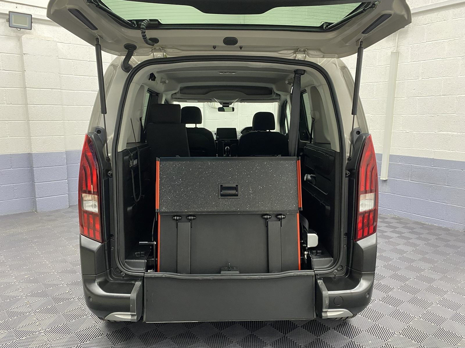 2020 rear wheelchair ramp in the upright position fitted to a Peugeot Rifter WAV vehicle SF70 KNX