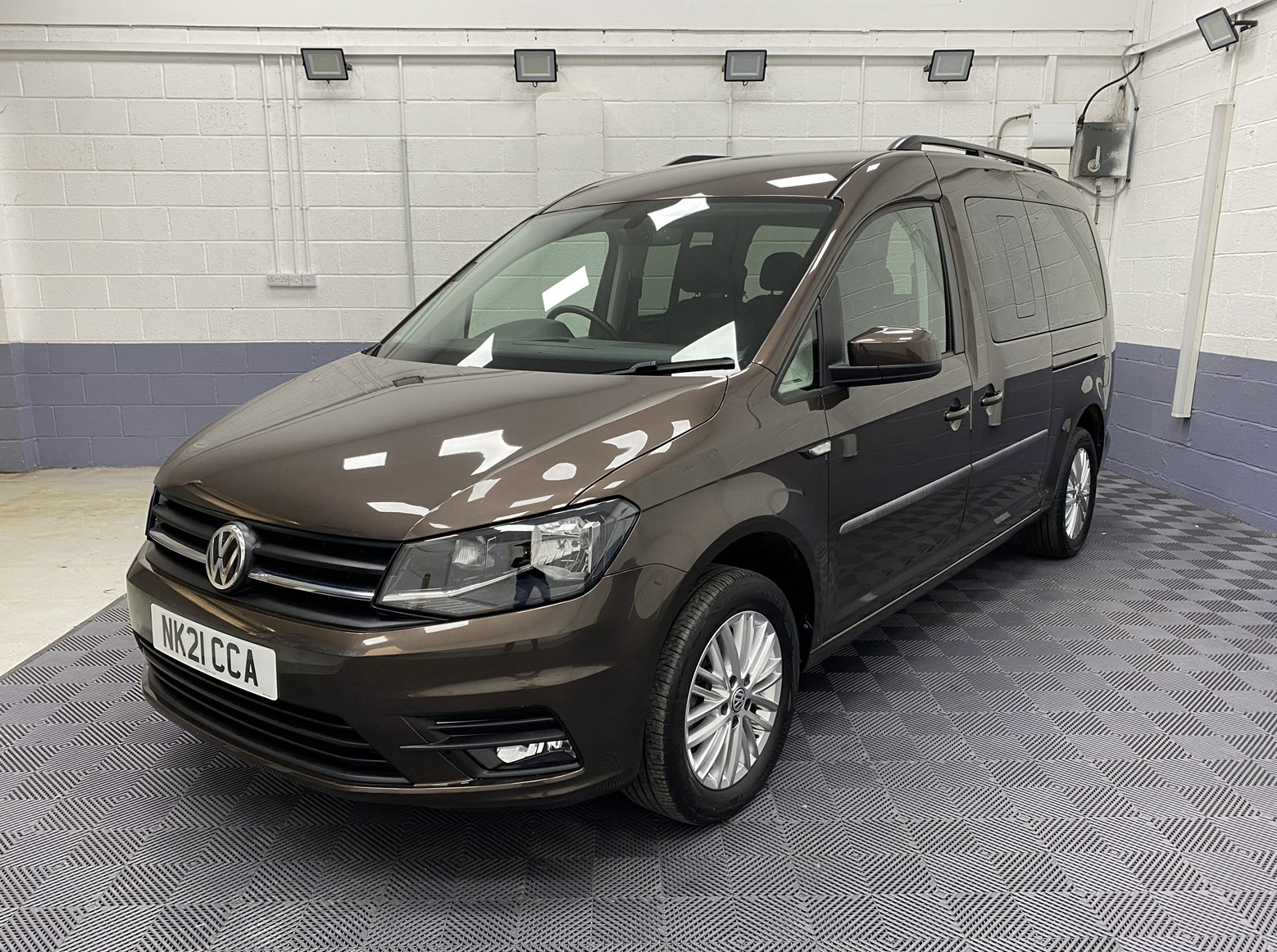 2021 Volkswagen Caddy Maxi in metallic bronze front three quarter of near side NK21 CCA