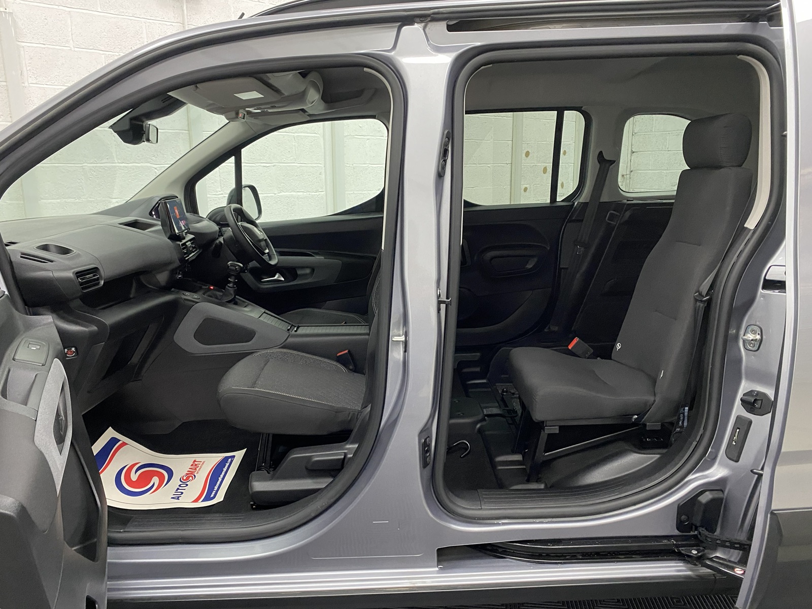 2025 wheelchair accessible Peugeot Rifter interior view showing front and rear seats SC74 XAO