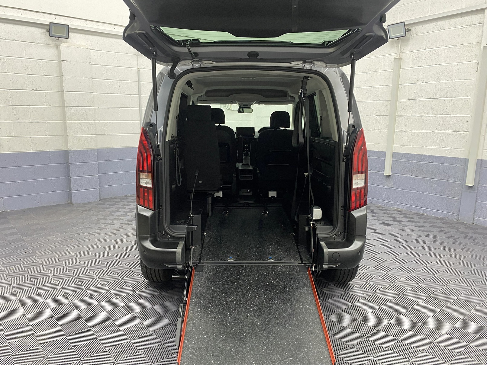 2025 wheelchair accessible Peugeot Rifter rear view showing the wheelchair ramp deployed SC74 XAO
