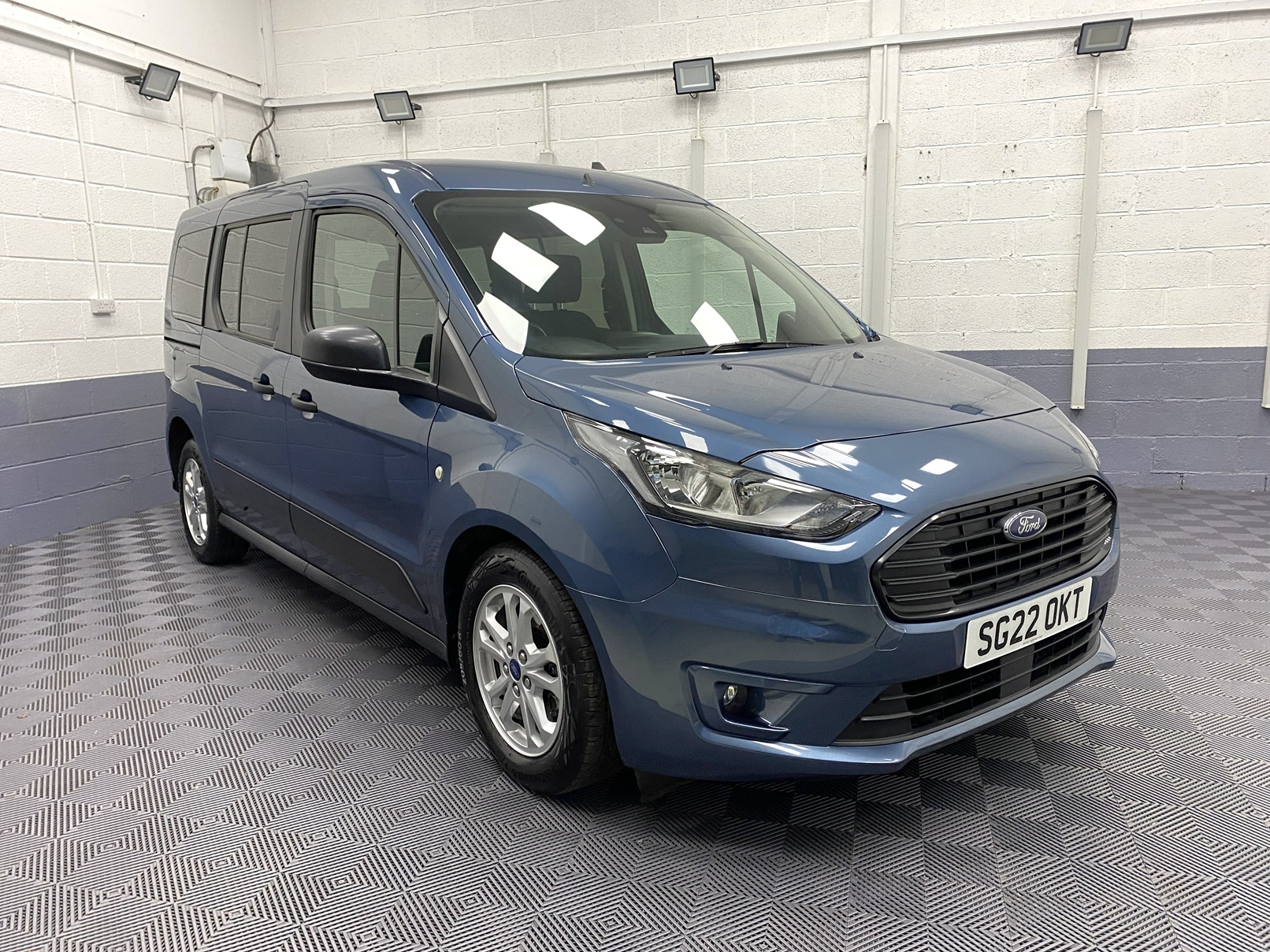2022 Blue Ford Grand Tourneo Connect Zetec front three quarter view SG22 OKT