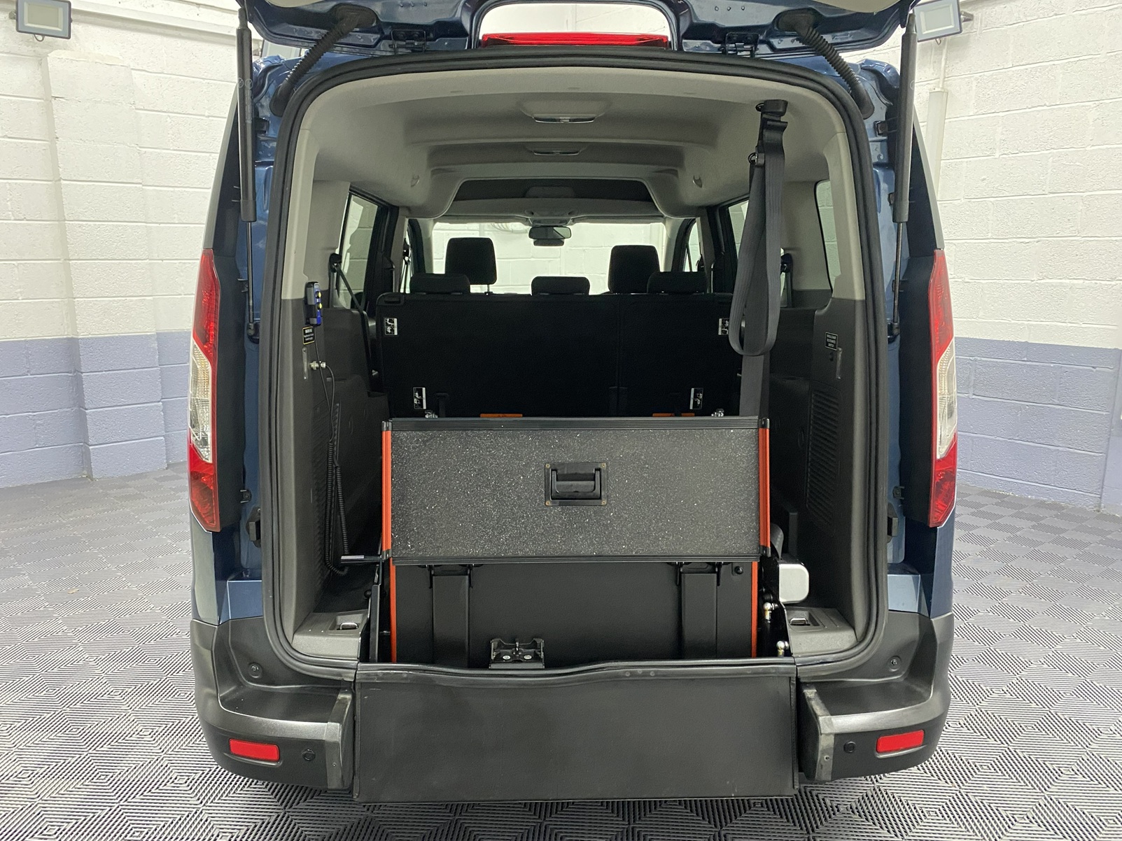 Rear wheelchair ramp in the stored position on a Ford Grand Tourneo Connect WAV SG22 OKT