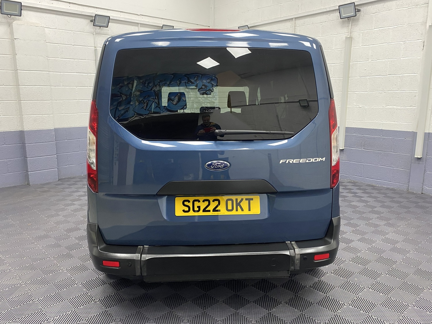 Blue Ford Grand Tourneo Connect Zetec rear view SG22 OKT