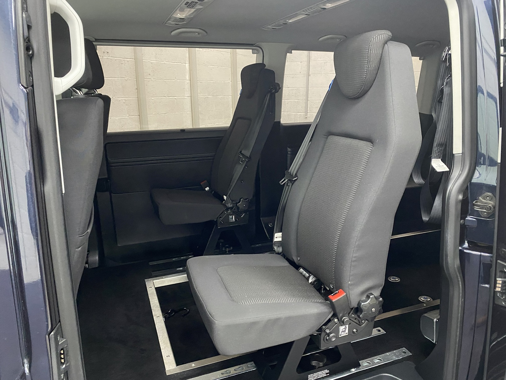 twin rear seats in a 2018 Volkswagen Transporter wheelchair accessible vehicle YJ68 BMU