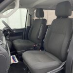 Front twin single seats in grey upholstery in a 2018 Volkswagen Transporter T6 YJ68 BMU