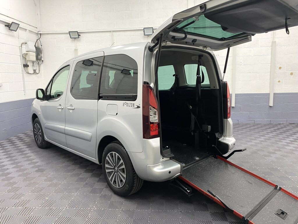2019 Silver Peugeot Partner wheelchair accessible vehicle side view with rear wheelchair ramp deployed SDF68 FKN
