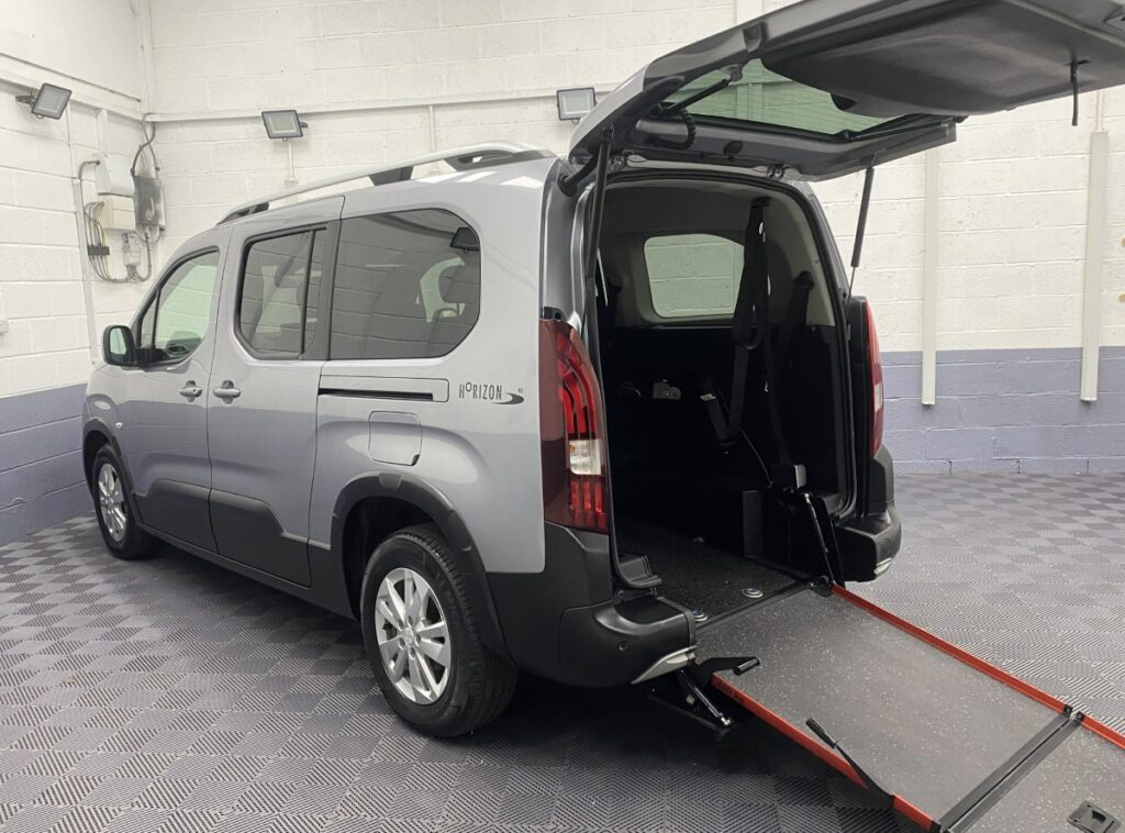 2021 Peugeot Rifter Long Wheelbase wheelchair accessible vehicle rear three quarter view with wheelchair ramp deployed SB21GPV