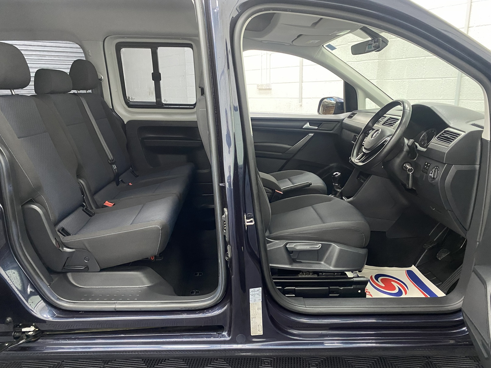 2018 Volkswagen Caddy Maxi interior view of both front and rear seats from drivers side YY68LHF