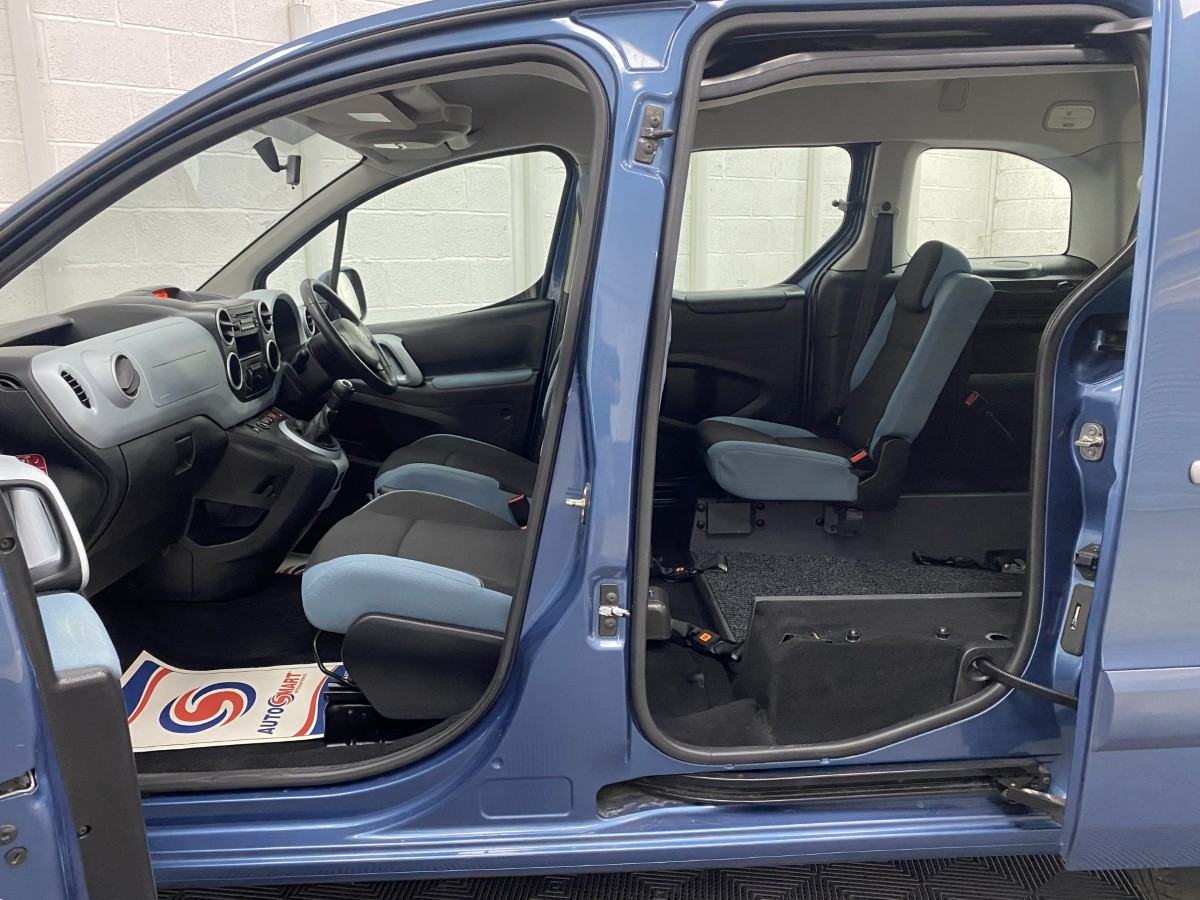 Citroen Berlingo WAV interior view showing both front and rear seats. WA64JEU