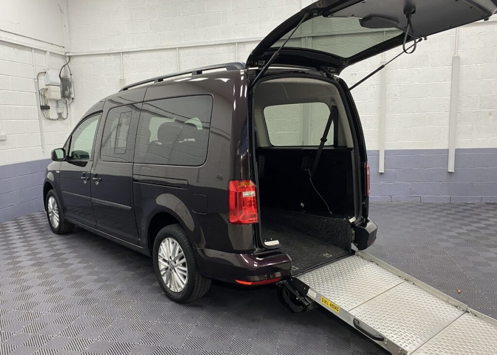 Volkswagen Caddy Maxi Wheelchair accessible vehicle rear three quarter view with rear ramp deployed NK70ASO