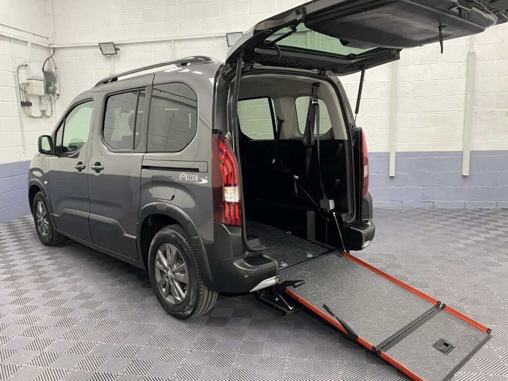 2023 Peugeot Rifter Automatic WAV rear three quarter view and wheelchair ramp deployed SB23KNC