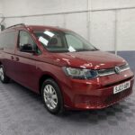 2023 Volkswagen Caddy Maxi front three quarter view with rear ramp deployed SJ23UDV