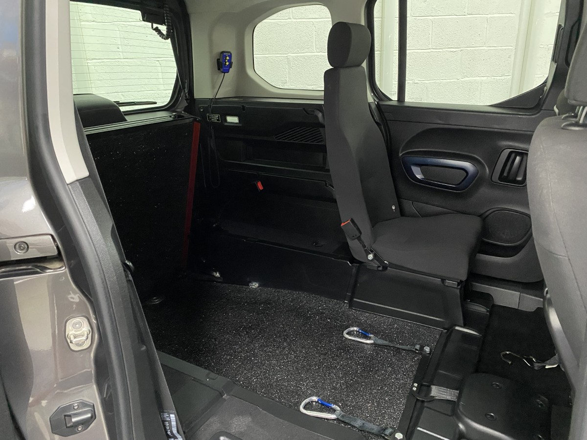 Lowered rear floor and single rear seat fitted to a Peugeot Rifter wheelchair accessible vehicle SB21GJK