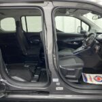 Peugeot Rifter wheelchair accessible vehicle interior view from side showing front seat and wheelchair area and single rear seat SB21GJK