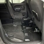 Front wheelchair restraints and electric wheelchair winch fitted to a Peugeot Rifter wheelchair accessible vehicle SB21GJF
