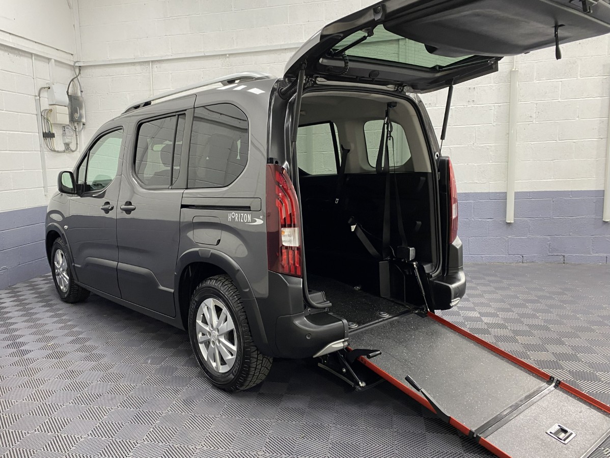 Peugeot Rifter Horizon wheelchair accessible vehicle rear three quarter view with rear ramp deployed SB21GJK