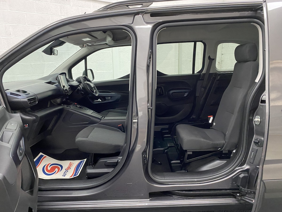 2023 Peugeot Rifter Automatic wheelchair accessible vehicle interior view of front seats and single rear seat from the passenger side. SB23XNG