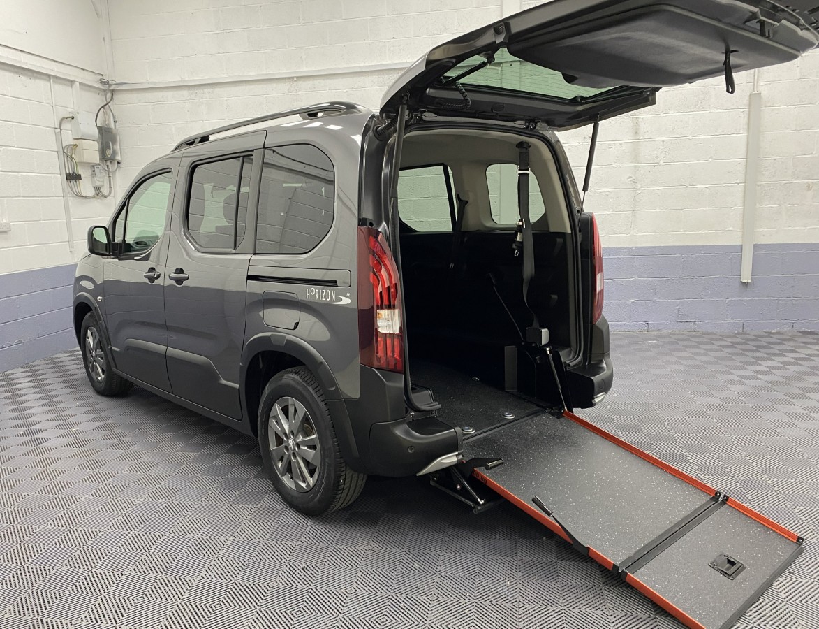 2023 Peugeot Rifter Automatic wheelchair accessible vehicle rear three quarter view with rear ramp deployed. SB23XNG