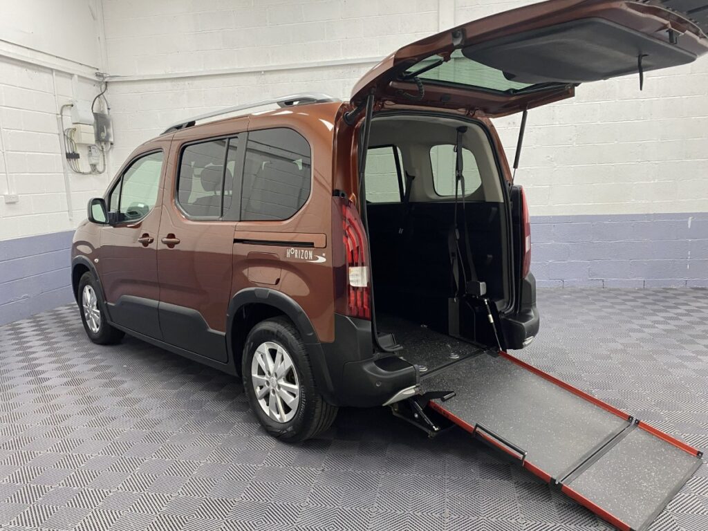 Wheelchair accessible Peugeot Rifter Automatic rear three quarter view with wheelchair ramp deployed SF19CCU