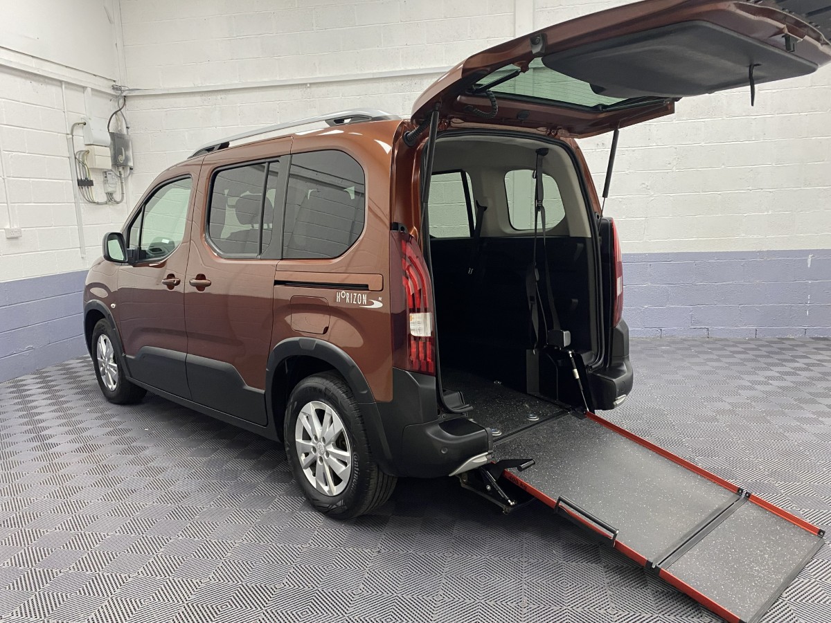 Wheelchair accessible Peugeot Rifter Automatic rear three quarter view with wheelchair ramp deployed SF19CCU