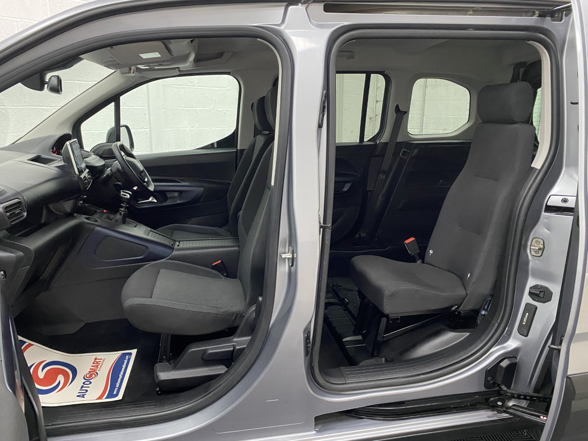 Peugeot Rifter wheelchair accessible vehicle showing both and front and rear seats from the side SA22YCE